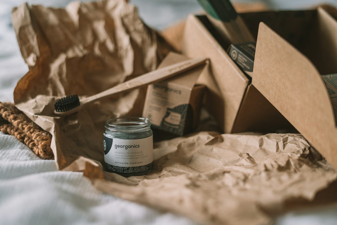 A product packaged in a cardboard box, illustrating why packaging material and end-of-life disposal both matter